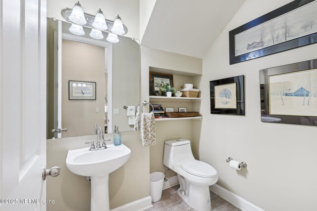 2011 Pond Ridge Ct Unit 1201, Fleming Island, FL 32003 - half bath featuring toilet, lofted ceiling, and baseboards