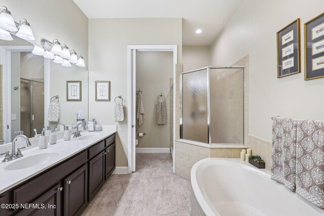 2011 Pond Ridge Ct Unit 1201, Fleming Island, FL 32003 - full bath featuring a garden tub, double vanity, a shower stall, and toilet