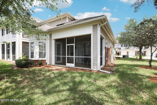 2011 Pond Ridge Ct Unit 1201, Fleming Island, FL 32003 - back of house featuring a sunroom, a yard, and central air condition unit