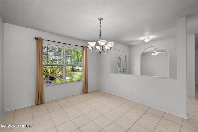 226 Crystal Cove Dr, Palatka, FL 32177 - spare room featuring ceiling fan with notable chandelier, baseboards, and light tile patterned floors