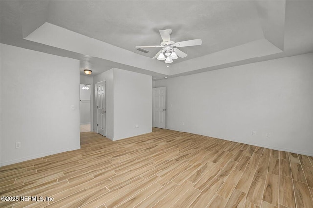226 Crystal Cove Dr, Palatka, FL 32177 - unfurnished room with visible vents, light wood-style floors, and a raised ceiling