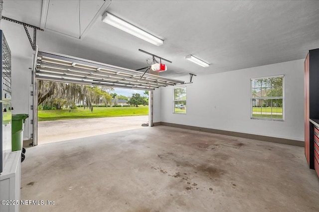 226 Crystal Cove Dr, Palatka, FL 32177 - garage with baseboards and a garage door opener