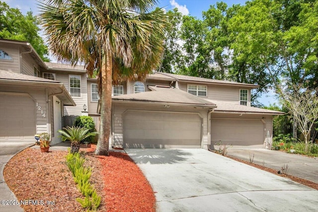 1216 Radis Pl, Jacksonville, FL 32225 - view of property with concrete driveway and a garage