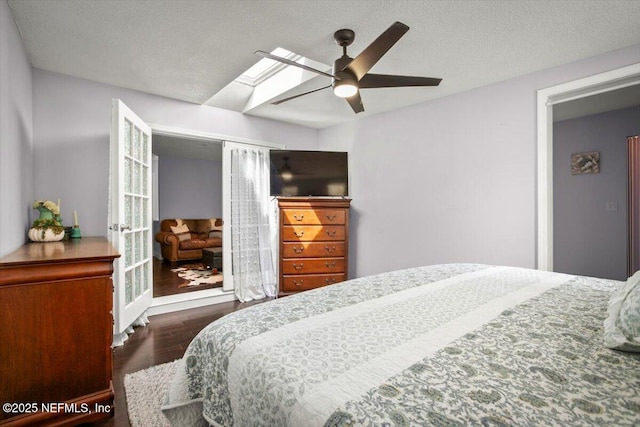 1216 Radis Pl, Jacksonville, FL 32225 - bedroom featuring a ceiling fan, wood finished floors, a skylight, and a textured ceiling