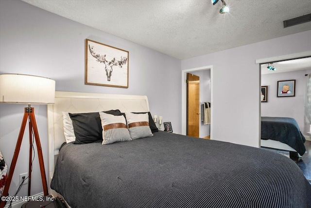 1216 Radis Pl, Jacksonville, FL 32225 - bedroom featuring visible vents and a textured ceiling