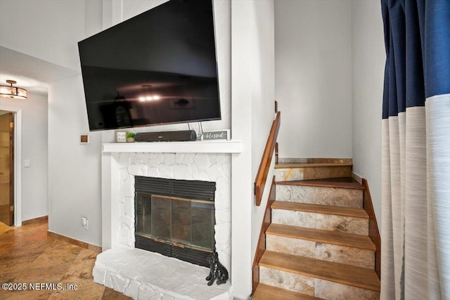 1216 Radis Pl, Jacksonville, FL 32225 - staircase featuring baseboards and a fireplace