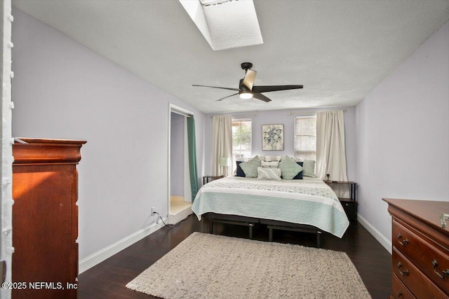1216 Radis Pl, Jacksonville, FL 32225 - bedroom featuring a ceiling fan, a skylight, baseboards, and dark wood finished floors