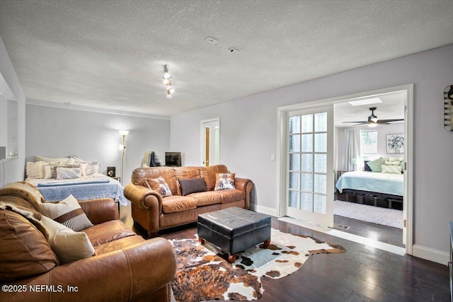 1216 Radis Pl, Jacksonville, FL 32225 - living area with a textured ceiling, baseboards, and wood finished floors