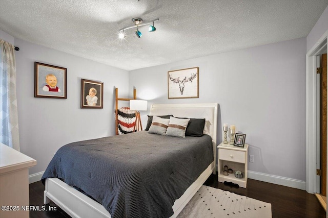 1216 Radis Pl, Jacksonville, FL 32225 - bedroom featuring baseboards, wood finished floors, and a textured ceiling