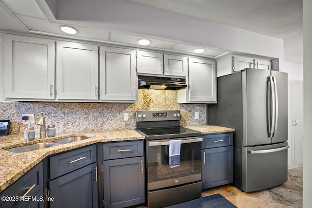 1216 Radis Pl, Jacksonville, FL 32225 - kitchen with stainless steel appliances, tasteful backsplash, under cabinet range hood, a sink, and light stone counters