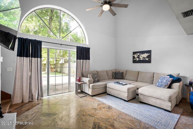 1216 Radis Pl, Jacksonville, FL 32225 - living area featuring a high ceiling, a ceiling fan, and visible vents