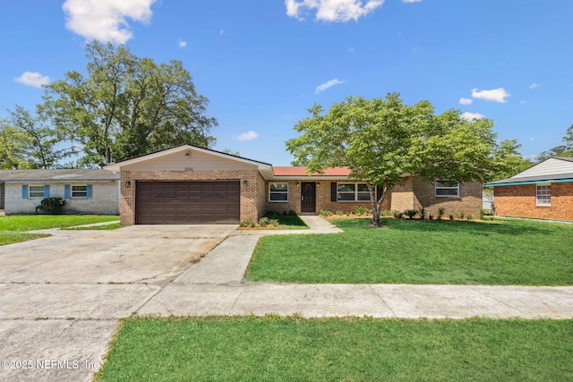 single story home featuring a garage, brick siding, a front lawn, and driveway