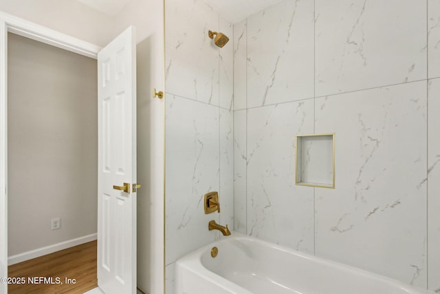 full bathroom featuring shower / bathtub combination, wood finished floors, and baseboards