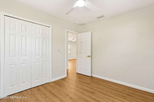 unfurnished bedroom with baseboards, visible vents, and light wood-style flooring