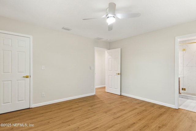 unfurnished bedroom with light wood-style flooring, ceiling fan, ensuite bathroom, baseboards, and visible vents