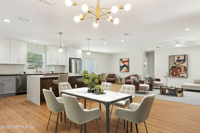 dining room with visible vents, recessed lighting, and light wood-style flooring