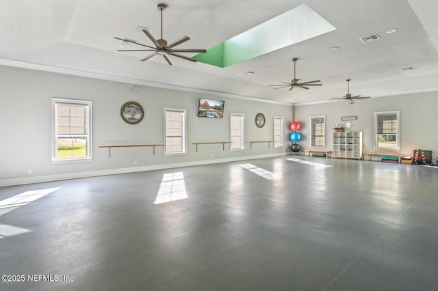 interior space with visible vents, baseboards, and a ceiling fan