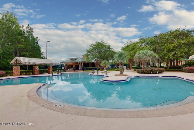 community pool featuring a patio and a gazebo