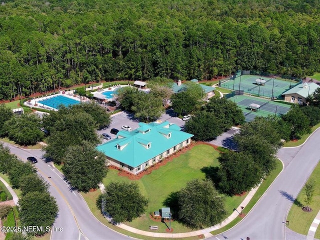 drone / aerial view featuring a forest view