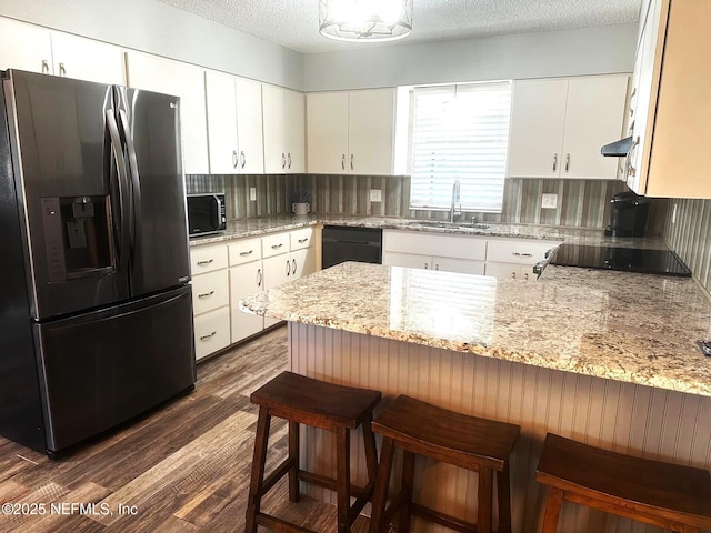 111 Magnolia Dr, East Palatka, FL 32131 - kitchen with decorative backsplash, a peninsula, black dishwasher, stainless steel refrigerator with ice dispenser, and dark wood-style floors