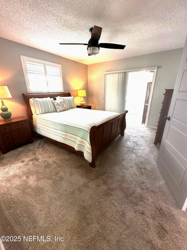 111 Magnolia Dr, East Palatka, FL 32131 - unfurnished bedroom featuring ceiling fan, carpet floors, and a textured ceiling