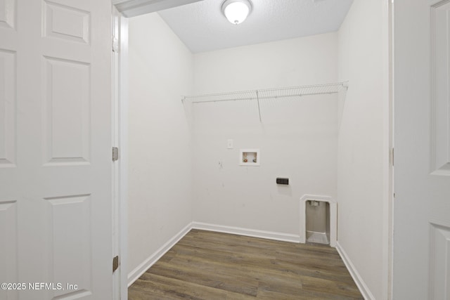 1832 Navaho Ave, Jacksonville, FL 32210 - laundry room featuring a textured ceiling, dark wood finished floors, laundry area, baseboards, and hookup for a washing machine