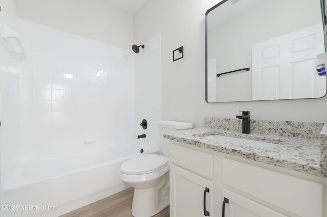 2895 Cross Creek Dr, Green Cove Springs, FL 32043 - full bath featuring toilet, vanity, washtub / shower combination, and wood finished floors