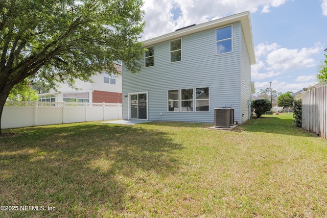 2895 Cross Creek Dr, Green Cove Springs, FL 32043 - rear view of house with a fenced backyard, central air condition unit, and a yard