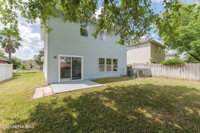 2895 Cross Creek Dr, Green Cove Springs, FL 32043 - rear view of property with a patio, central AC, fence, and a lawn