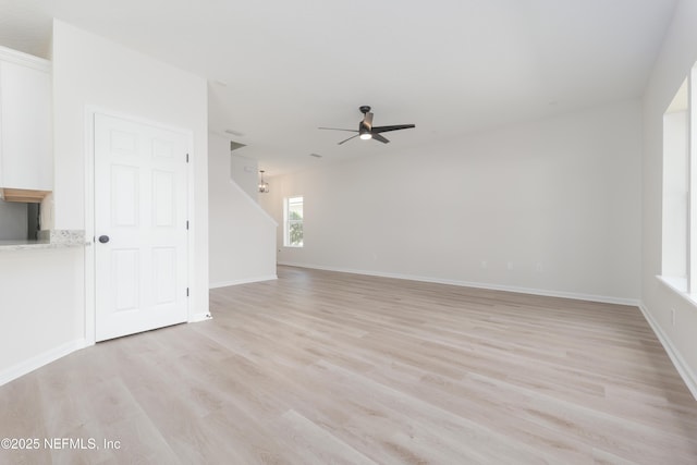 2895 Cross Creek Dr, Green Cove Springs, FL 32043 - empty room featuring a ceiling fan, baseboards, and light wood-style flooring