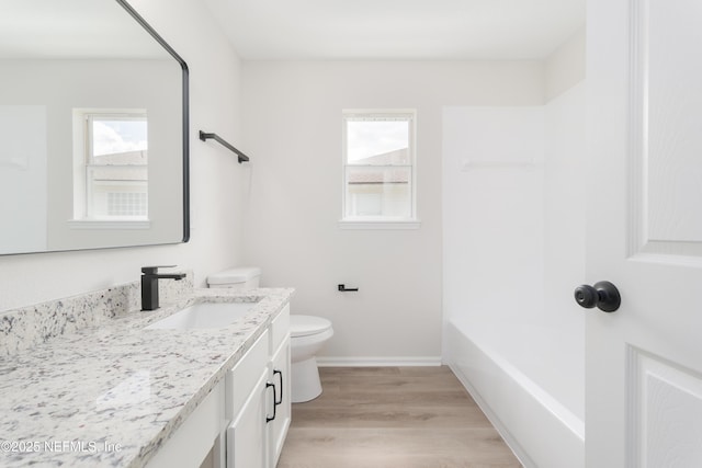 2895 Cross Creek Dr, Green Cove Springs, FL 32043 - bathroom with vanity, plenty of natural light, toilet, and wood finished floors