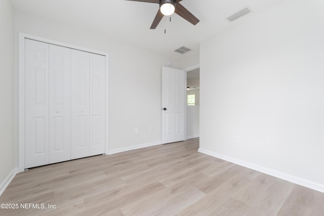 2895 Cross Creek Dr, Green Cove Springs, FL 32043 - unfurnished bedroom with baseboards, a closet, light wood finished floors, and visible vents
