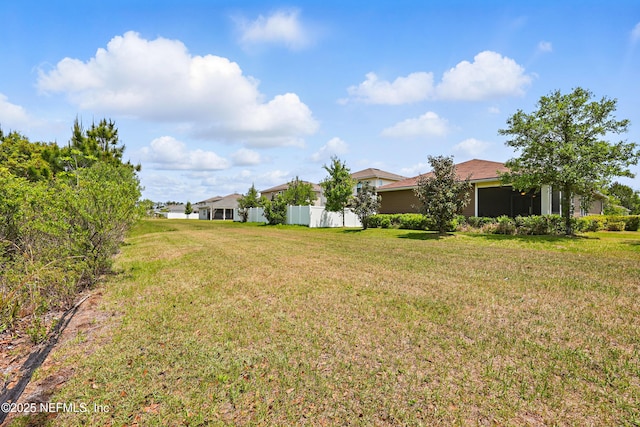 view of yard with fence