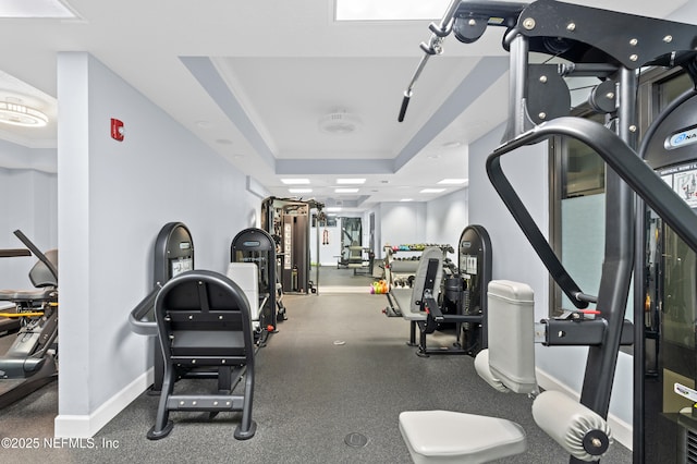 1478 Riverplace Blvd Unit 803, Jacksonville, FL 32207 - gym with a tray ceiling and baseboards