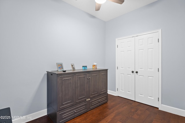 1478 Riverplace Blvd Unit 803, Jacksonville, FL 32207 - bedroom with baseboards, dark wood-style floors, a closet, and ceiling fan