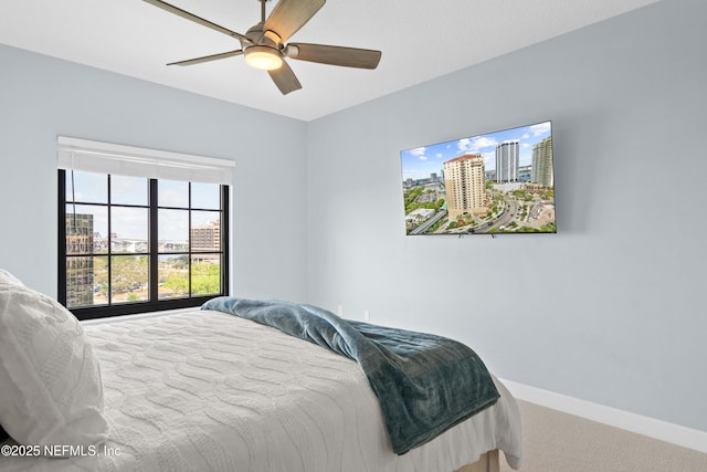 1478 Riverplace Blvd Unit 803, Jacksonville, FL 32207 - bedroom with a ceiling fan, carpet floors, and baseboards