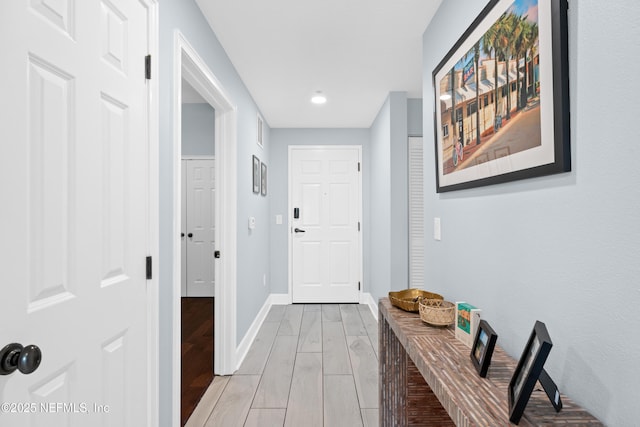 1478 Riverplace Blvd Unit 803, Jacksonville, FL 32207 - hallway with baseboards, visible vents, and light wood-style floors
