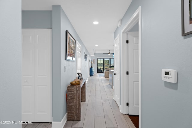1478 Riverplace Blvd Unit 803, Jacksonville, FL 32207 - hall with wood tiled floor, baseboards, and recessed lighting