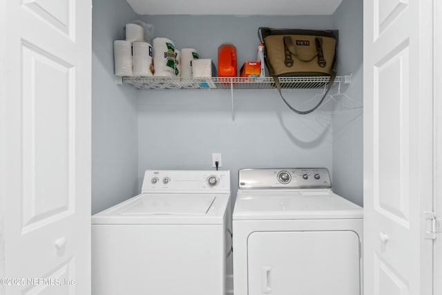 1478 Riverplace Blvd Unit 803, Jacksonville, FL 32207 - laundry room with washing machine and clothes dryer and laundry area