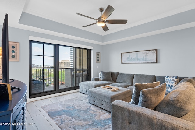 1478 Riverplace Blvd Unit 803, Jacksonville, FL 32207 - living room featuring a raised ceiling and ceiling fan