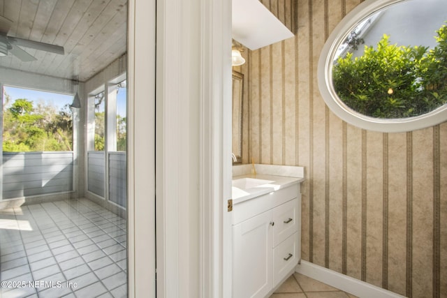 bathroom featuring wallpapered walls, tile patterned flooring, and ceiling fan