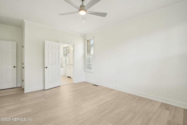 unfurnished bedroom with baseboards, ornamental molding, visible vents, and light wood finished floors