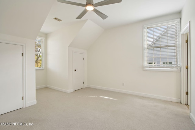 bonus room featuring baseboards, a ceiling fan, carpet flooring, and visible vents