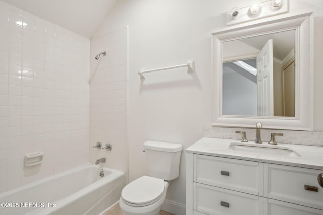 bathroom featuring toilet, lofted ceiling, vanity, and shower / bathing tub combination