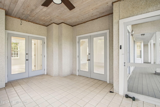 unfurnished sunroom with french doors
