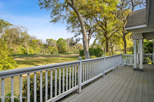 wooden deck with a yard