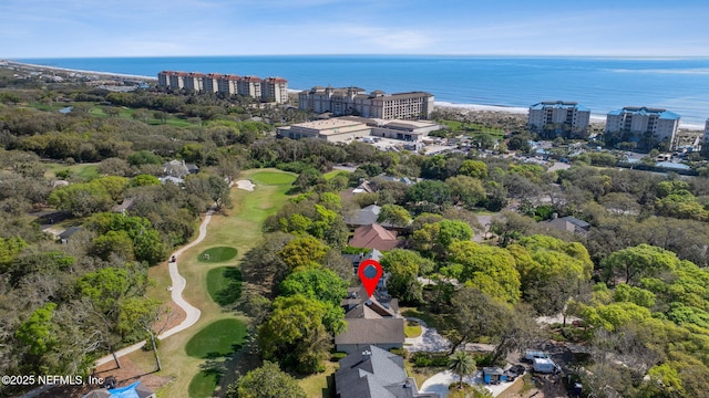 bird's eye view with view of golf course and a water view