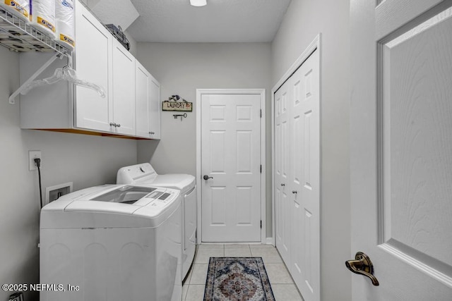 714 Copperhead Cir, Saint Augustine, FL 32092 - laundry area featuring cabinet space, independent washer and dryer, and light tile patterned floors