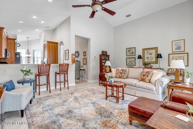 714 Copperhead Cir, Saint Augustine, FL 32092 - living area featuring vaulted ceiling, visible vents, arched walkways, and a ceiling fan