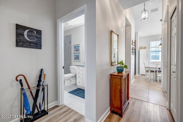 714 Copperhead Cir, Saint Augustine, FL 32092 - corridor with baseboards, visible vents, and light wood-style floors